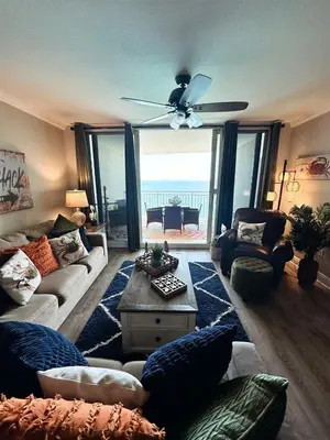 a living room with a couch and a ceiling fan at Cheap Getaway, Ocean View, PCB in Panama City Beach