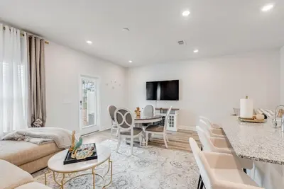 a living room with a couch and a table at Bright 3BR Near Beach Vacation House in Panama City Beach
