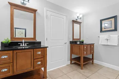 a bathroom with a sink and a mirror at Gulf-View Condo with Pool, Grill, Gym & Beachfront Resort Perks! in Panama City Beach