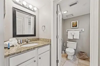 a bathroom with a sink and a toilet at Commodore 0806 in Panama City Beach