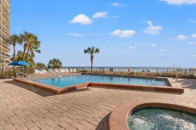 a large swimming pool next to the beach at Commodore 0806 in Panama City Beach