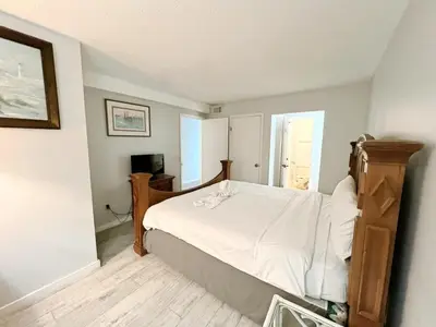 a bedroom with a bed and a television in it at The Summit 618 - Bright Waterfront Condo in Panama City Beach