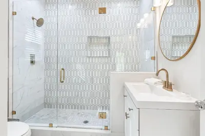 a white bathroom with a shower and a sink at Our Seaside 4 BR Seagrove, HEATED Pool, bikes and 5 min to the beach in Santa Rosa Beach