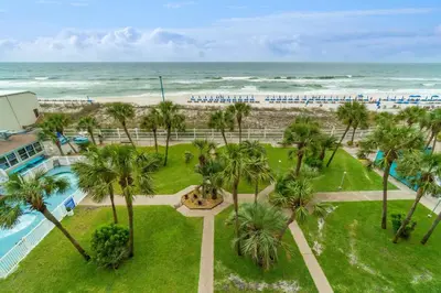 an aerial view of a resort with a pool and the beach at The Summit 529 - Newly Remolded Beachfront Condo in Panama City Beach