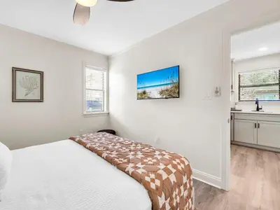 a white bedroom with a bed and a window at Beachwood Villas 1G - The Nest at Seagrove in Santa Rosa Beach