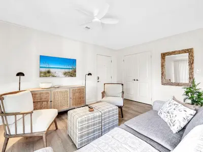 a living room with a couch and a table at Beachwood Villas 1G - The Nest at Seagrove in Santa Rosa Beach