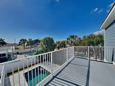 a balcony with a view of a swimming pool at Horizon Dreams B in Panama City Beach