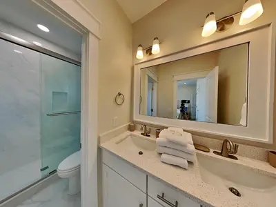 a bathroom with a sink and a mirror at Horizon Dreams B in Panama City Beach