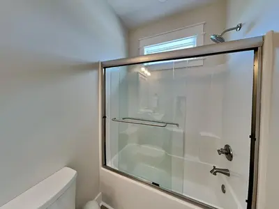 a bathroom with a shower with a glass door at Horizon Dreams B in Panama City Beach