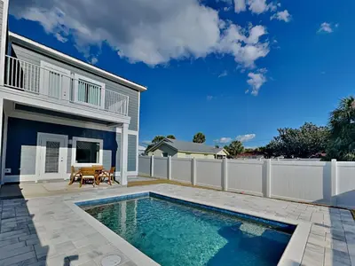 a swimming pool in the backyard of a house at Horizon Dreams in Panama City Beach