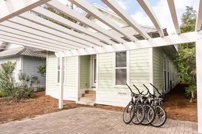 a group of bikes parked on the side of a house at Glory Days 30A - Pool, Bikes & Close Beach Access in Inlet Beach