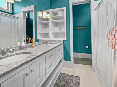 a bathroom with a sink and a mirror at 224 Winston Ln l 4 Bikes Included l Beachfront with Amazing view l Community Pool in Inlet Beach