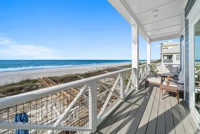 a porch with a view of the beach at Blessings at Pier Park l Luxury l Gulf Front Oasis with Private Pool l Steps From Pier Park in Panama City Beach