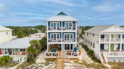 an aerial view of a large house with a balcony at Blessings at Pier Park l Luxury l Gulf Front Oasis with Private Pool l Steps From Pier Park in Panama City Beach