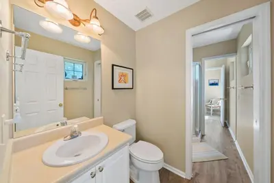 a bathroom with a sink and a toilet at Blue Palm l Minutes to Sandy White Beach l Bike to Rosemary Beach in Inlet Beach