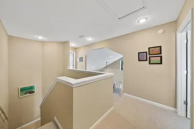 a hallway with a staircase in a house at Blue Palm l Minutes to Sandy White Beach l Bike to Rosemary Beach in Inlet Beach