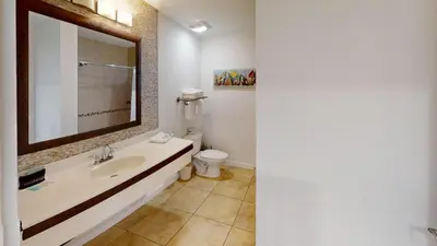 a bathroom with a sink and a toilet at Origins at Seahaven 1504 in Panama City Beach