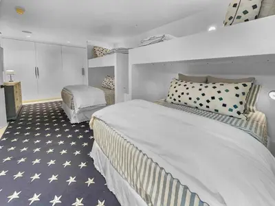 a hotel room with two beds and a bedroom at Dream On l Beachfront l Golf cart and 4 Bikes Included l Gulf Front Private Pool in Seacrest