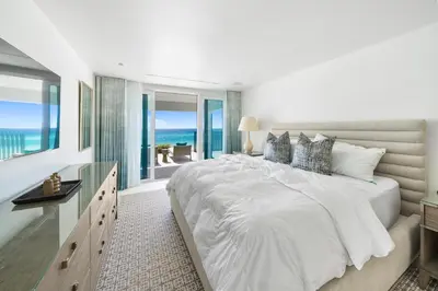 a white bedroom with a large bed with a view of the ocean at Dream On l Beachfront l Golf cart and 4 Bikes Included l Gulf Front Private Pool in Seacrest