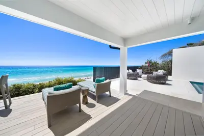 a living room with a view of the ocean at Dream On l Beachfront l Golf cart and 4 Bikes Included l Gulf Front Private Pool in Seacrest