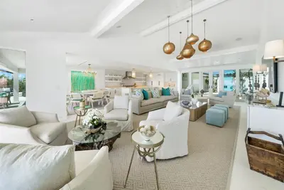 a living room with white couches and a table at Dream On l Beachfront l Golf cart and 4 Bikes Included l Gulf Front Private Pool in Seacrest