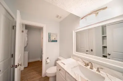 a bathroom with a sink and a toilet at Eastern Shores 206 l Beachfront l Pristine Beach Views l 2 Bikes included in Santa Rosa Beach