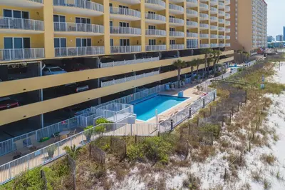 an aerial view of a hotel with a swimming pool at Emerald Isle l Beachfront l Amazing beach views l Heated Community Pool l Fitness center in Panama City Beach