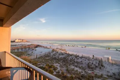 a view of the beach from the balcony of a condo at Endless Waves 208 l Beachfront l Stunning Beach Views l Bike to Seaside in Santa Rosa Beach