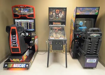 a group of arcade games and video game consoles at Origin at Seahaven 402 in Panama City Beach