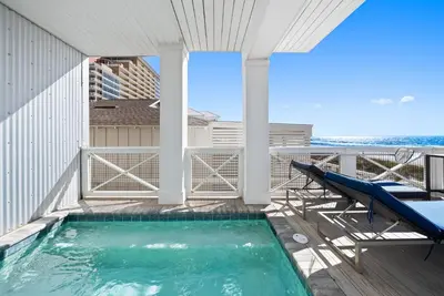 a swimming pool on the balcony of a building at Joy by the Sea l Private heatable pool l Beach Front l Family Activities nearby in Panama City Beach