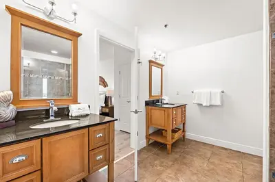 a bathroom with a sink and a mirror at Sterling Breeze 307 by Emerald Coast Retreats in Panama City Beach