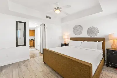 a bedroom with a large bed and two lamps at Sterling Breeze 307 by Emerald Coast Retreats in Panama City Beach