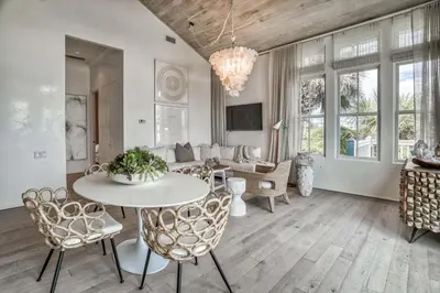 a living room with a table and chairs at Love Shack in Inlet Beach
