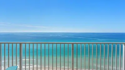 a view of the ocean from a balcony at Gulf-Front PCB Condo w Balcony Resort Amenities Game Room Pools Beach Gear Tortuga 1301 by AvantStay in Panama City Beach
