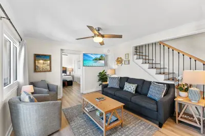 a living room with a couch and a table at Sunshine at PP A-914 in Panama City Beach