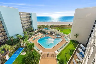 an aerial view of a resort with a pool and the beach at Beachfront Studio with Pool & Gulf Views! by Dolce Vita Getaways PCB in Panama City Beach