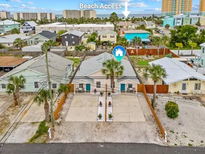 an aerial view of a neighborhood with houses and palm trees at Sunset Retreat TOO - 2BR - 4 Min Walk to Beach in Panama City Beach