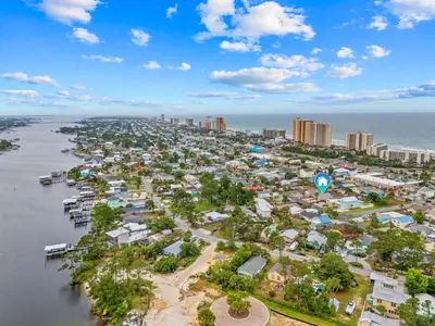 an aerial view of a city next to the water at 4 Min Walk to Sand - 2BR - King Bed - Private Yard in Panama City Beach