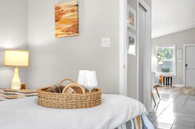 a basket sitting on top of a table in a room at Sunset Dreams TOO - King Bed - 5 Min Walk to Beach in Panama City Beach