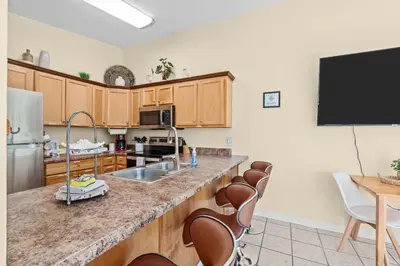 a kitchen with a sink and a counter top at The Sand Dollar - King Bed - 6 Min Walk to Beach in Panama City Beach