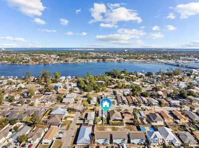 an aerial view of a city with a river and houses at The Sand Dollar - King Bed - 6 Min Walk to Beach in Panama City Beach