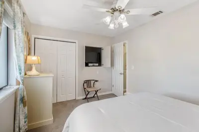 a bedroom with a bed and a ceiling fan at Family Ready 3BR 2.5BA Home, Near Parks, Shops And Beach in Panama City Beach