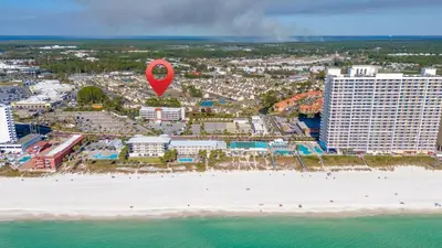 an aerial view of a beach with a red marker at Family Ready 3BR 2.5BA Home, Near Parks, Shops And Beach in Panama City Beach