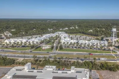 an aerial view of a campus with buildings and roads at Sunlit Sands in Inlet Beach