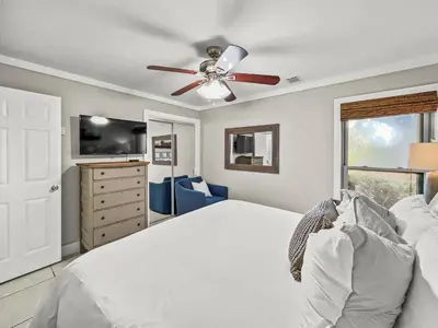 a bedroom with a bed and a ceiling fan at Inlet Dunes 101 l Community Pool l Across From The Beach in Inlet Beach
