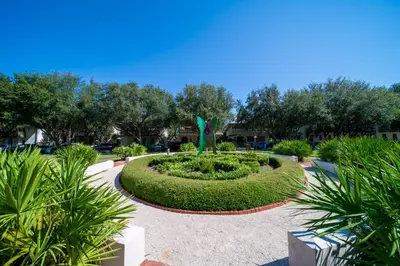 a park with a circular garden in the middle at Inlet Dunes 105 l Community Pool l Across From The Beach in Inlet Beach