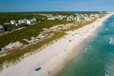 an aerial view of a beach with people on it at Inlet Dunes 201 l Community Pool l Across From The Beach in Inlet Beach