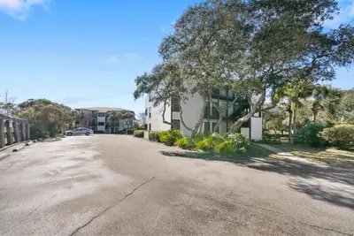 an empty street in front of a house at Inlet Dunes 201 l Community Pool l Across From The Beach in Inlet Beach