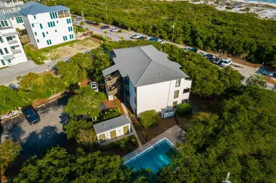 an aerial view of a house with a pool at Inlet Dunes 201 l Community Pool l Across From The Beach in Inlet Beach