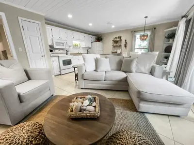 a living room with a couch and a table at Inlet Dunes 201 l Community Pool l Across From The Beach in Inlet Beach